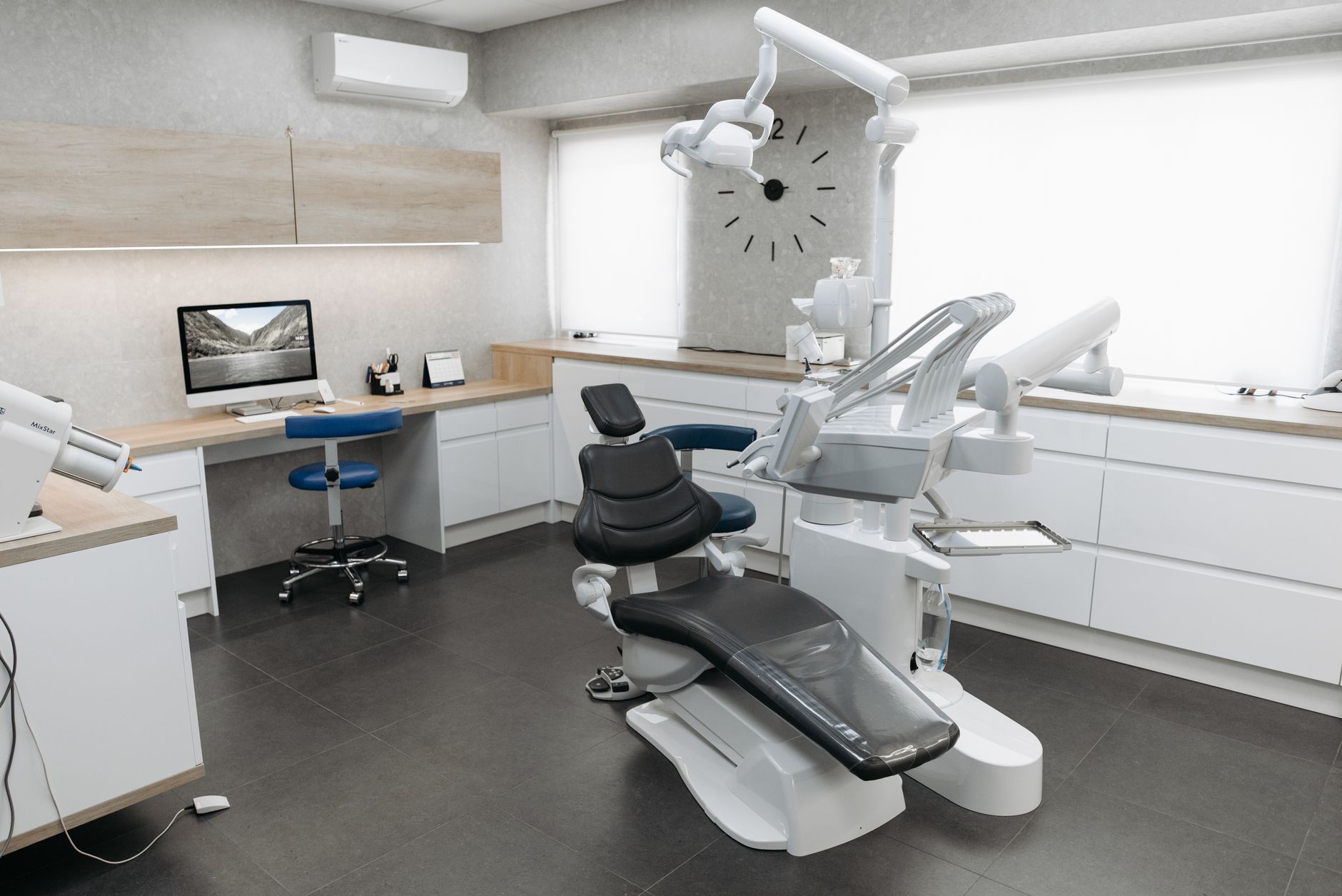A dentist at Vantara explaining digital diagnostic findings on a tablet during consultation